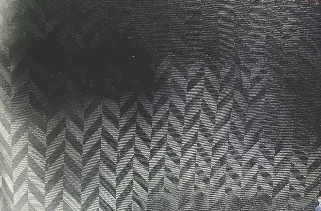 Linings 28907-52 BLACK HERRINGBONE fabric swatch